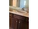 Bathroom vanity with dark wood cabinets, decorative pulls and ample counter space at 2958 Parc Lorraine, Lithonia, GA 30038