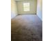 Bedroom with neutral carpet and a window providing natural light at 2958 Parc Lorraine, Lithonia, GA 30038