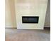 Modern electric fireplace adds a cozy touch to this carpeted living room at 2958 Parc Lorraine, Lithonia, GA 30038
