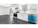 Modern kitchen featuring stainless steel appliances, white cabinets, and tile flooring at 5726 Southwick Sw Ct, College Park, GA 30349