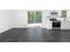 View of a bright kitchen with stainless steel appliances and sliding glass doors at 5726 Southwick Sw Ct, College Park, GA 30349