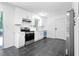 Bright kitchen with white cabinets, stainless steel appliances and outdoor view at 5726 Southwick Sw Ct, College Park, GA 30349