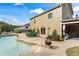 A backyard with an in-ground pool, patio area with seating, and well-maintained landscaping at 108 Summer Breeze Ln, Canton, GA 30114