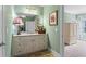 Bathroom with a granite counter vanity and decorative accents and open door at 108 Summer Breeze Ln, Canton, GA 30114