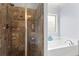 Modern bathroom with a glass-enclosed shower, and a separate soaking tub for relaxation at 108 Summer Breeze Ln, Canton, GA 30114