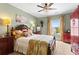 Cozy bedroom with decorative lamps, ornate wooden furniture, and beautiful details at 108 Summer Breeze Ln, Canton, GA 30114