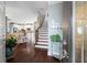 Open-concept home foyer showcasing hardwood floors, staircase, and views into the living spaces at 108 Summer Breeze Ln, Canton, GA 30114