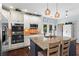 Modern kitchen featuring stainless steel appliances, granite countertops, and a spacious island with seating at 108 Summer Breeze Ln, Canton, GA 30114