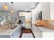 Spacious kitchen with a granite island, stainless steel appliances, and open layout to the dining area at 108 Summer Breeze Ln, Canton, GA 30114