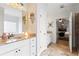 Well-lit primary bathroom featuring double vanities, granite countertops, and tile flooring at 108 Summer Breeze Ln, Canton, GA 30114
