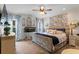Inviting primary bedroom with a decorative headboard, fish tank, and large windows at 108 Summer Breeze Ln, Canton, GA 30114
