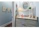 Charming powder room with granite countertop, decorative mirror, and stylish wall sconces at 108 Summer Breeze Ln, Canton, GA 30114