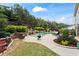 Beautiful swimming pool with a rock waterfall feature and ample patio space for entertaining at 108 Summer Breeze Ln, Canton, GA 30114
