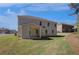 Large backyard featuring a covered patio and ample green space, ideal for outdoor activities at 141 Frontier Way, Mcdonough, GA 30253