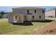 Expansive backyard featuring a covered patio and a well-maintained lawn, perfect for outdoor enjoyment at 141 Frontier Way, Mcdonough, GA 30253