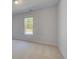 Neutral bedroom with light-colored carpet and a bright window at 141 Frontier Way, Mcdonough, GA 30253