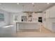 Modern kitchen with white cabinets, stainless steel appliances, and a large island perfect for entertaining at 141 Frontier Way, Mcdonough, GA 30253