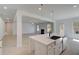 Open-concept kitchen and living area featuring a kitchen island with pendant lighting at 141 Frontier Way, Mcdonough, GA 30253