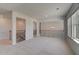 Spacious living room with large windows and iron railing at 141 Frontier Way, Mcdonough, GA 30253
