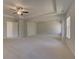 Spacious living room with plush carpeting and ceiling fan at 141 Frontier Way, Mcdonough, GA 30253