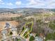 Aerial shot of the neighborhood showing the home nestled among mature trees at 1925 Emerald Dr, Cumming, GA 30040