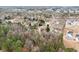 An aerial view showcases the neighborhood with mature trees and well-spaced homes at 1925 Emerald Dr, Cumming, GA 30040