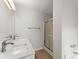 Bathroom featuring double sinks, modern fixtures, walk-in shower and soaking tub at 1925 Emerald Dr, Cumming, GA 30040
