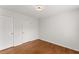 Bedroom highlighting hardwood floors and access to the closet at 1925 Emerald Dr, Cumming, GA 30040