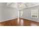 Spacious bedroom with hardwood floors, a ceiling fan, and plenty of natural light at 1925 Emerald Dr, Cumming, GA 30040