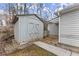 Exterior view of the shed in the backyard with double doors for ample storage at 1925 Emerald Dr, Cumming, GA 30040