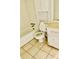 Functional bathroom featuring classic white fixtures and a tiled floor at 207 Tiburon Dr, Stonecrest, GA 30038