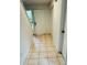 Hallway features tile floors leading into the home with an exterior glass door at 207 Tiburon Dr, Stonecrest, GA 30038