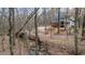 Scenic view of the house nestled among the trees with a stream in the foreground at 613 Rock Springs Pass, Dallas, GA 30157