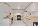 Well-lit kitchen with black appliances and butcher block countertops at 613 Rock Springs Pass, Dallas, GA 30157
