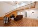 Bright living room featuring wood floors and an open floor plan with a leather sofa at 613 Rock Springs Pass, Dallas, GA 30157