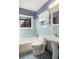 Quaint blue tiled bathroom featuring a shower-tub, vanity and cabinet at 1175 Kingsley Ne Cir, Atlanta, GA 30324