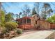 Charming home featuring unique wood shingles and a screened-in porch for outdoor living at 1175 Kingsley Ne Cir, Atlanta, GA 30324