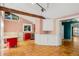 Bright kitchen with terracotta flooring, red cabinets, and an open layout leading to additional rooms at 1175 Kingsley Ne Cir, Atlanta, GA 30324