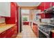 Stylish kitchen featuring red cabinets and stainless steel appliances at 1175 Kingsley Ne Cir, Atlanta, GA 30324