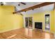 Cozy living room with hardwood floors, fireplace, and sliding glass doors at 1175 Kingsley Ne Cir, Atlanta, GA 30324