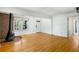 Bright living room features hardwood floors, fireplace, a large window and white trim at 1175 Kingsley Ne Cir, Atlanta, GA 30324