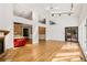 Living room with hardwood floors, fireplace, track lighting, multiple windows and openings to other rooms at 1175 Kingsley Ne Cir, Atlanta, GA 30324