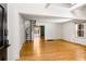 Open living room with hardwood floors, a spiral staircase and large window at 1175 Kingsley Ne Cir, Atlanta, GA 30324