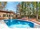 Backyard with swimming pool, hot tub, and wooden deck at 1175 Kingsley Ne Cir, Atlanta, GA 30324