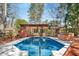 In ground swimming pool with a hot tub and a wooden deck at 1175 Kingsley Ne Cir, Atlanta, GA 30324