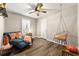 Relaxing bedroom featuring a stylish chaise lounge and a unique hanging chair at 4027 Cripple Creek Nw Dr, Kennesaw, GA 30144