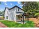 Exterior of home showcasing a covered patio and well-maintained lawn at 1158 Welch Sw St, Atlanta, GA 30310
