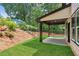 A covered patio extends from the house into the backyard at 1158 Welch Sw St, Atlanta, GA 30310
