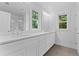 Bright bathroom with a double vanity, quartz countertop, and modern fixtures at 1158 Welch Sw St, Atlanta, GA 30310