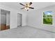 Spacious carpeted bedroom featuring an ensuite closet and windows at 1158 Welch Sw St, Atlanta, GA 30310